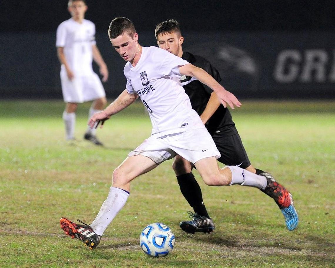 Green Hope's Connor Brookshire (front) keeps the ball from Holly Springs' Jared Waskey in 2015.