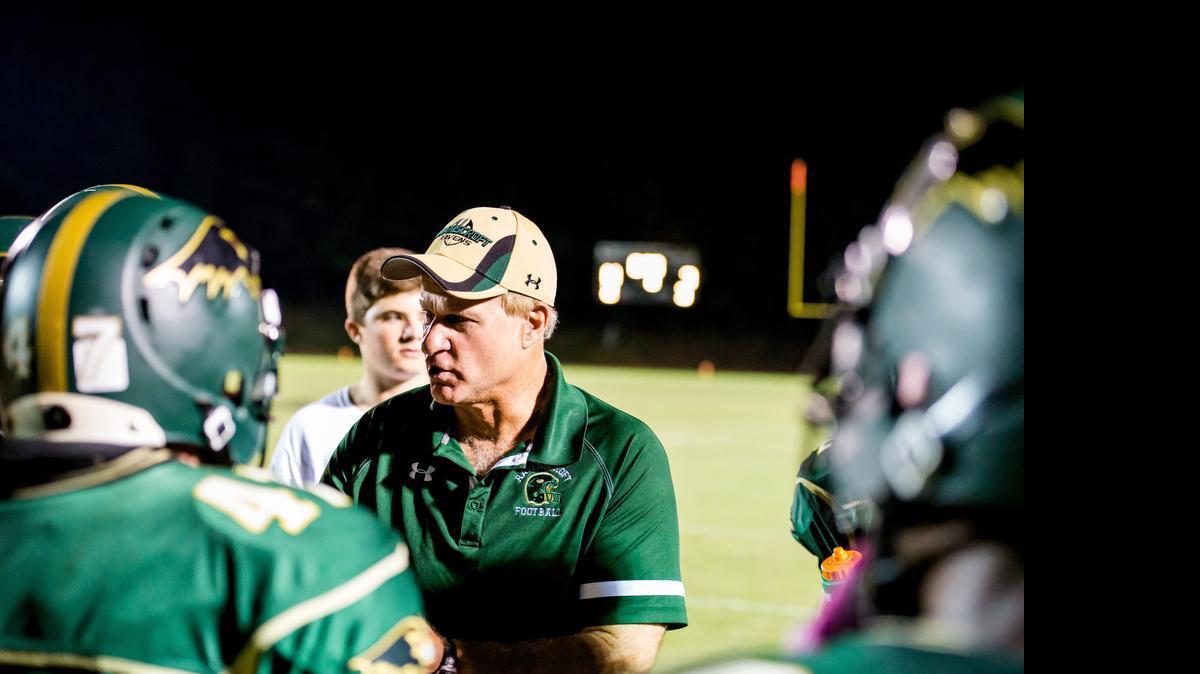 Head coach Ned Gonet of Ravenscroft talks with his players during a timeout in a football game played on Oct. 10 at Ravenscroft High School in Raleigh, N.C.