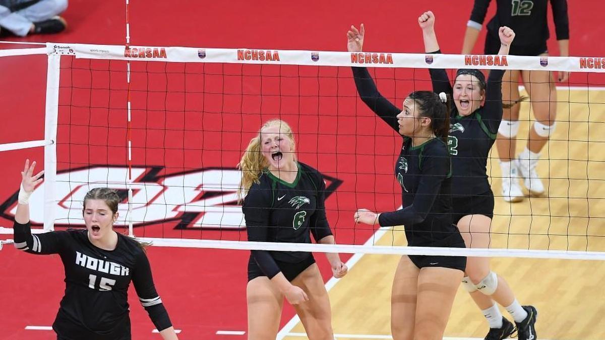 Sydney Dowler (6) of Green Hope celebrates along her teammates Alexis Engelbrecht, second from right, and Erin McIndoe, right, after blocking a shot from Olivia Cerick (15) of Hough. The Green Hope Falcons played the Hough Huskies in the 4A NCHSAA volleyball state final that took place at the N.C. State's Reynolds Coliseum in Raleigh, N.C. on Saturday, November 4, 2017. Green Hope won 3-0.