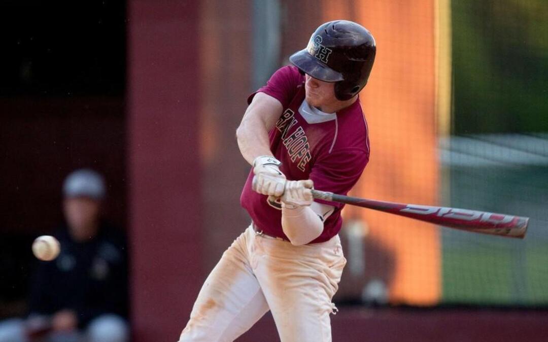 Green Hope centerfielder Trevor Losito swings at a pitch during of a high school baseball game against Holly Springs in Cary, N.C. on Friday, April 8, 2016.