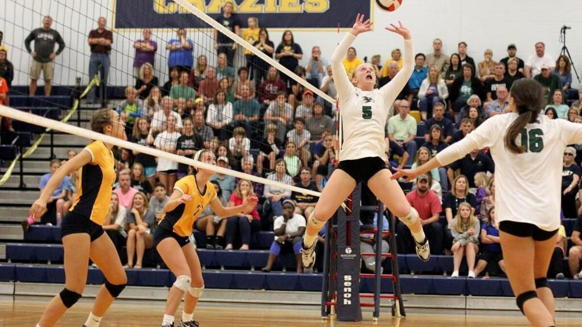 Green Hope's Sydney Dowler (5) in the air setting the ball during the Green Hope High School girls volleyball game against D.H. Conley High School in Greenville, N.C. on Thursday, November 3, 2016.