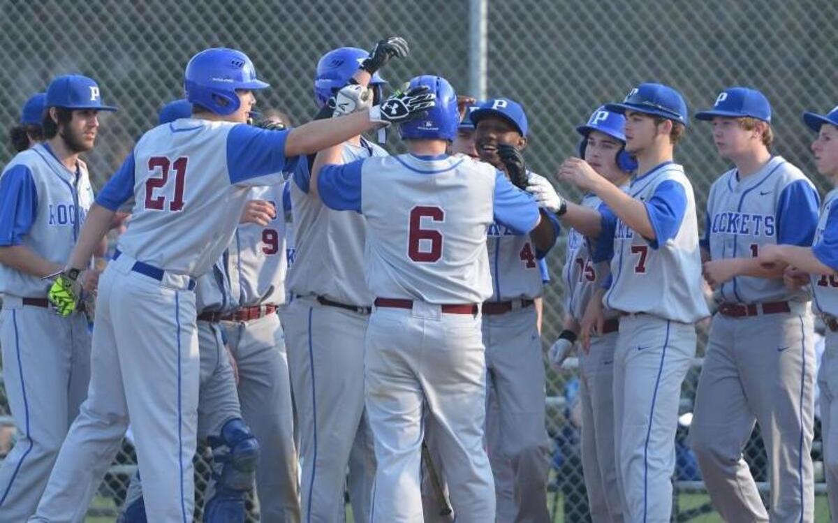 Drew Clayton (6) of Person is congratulated by his teammates after hitting a two-run home run for the Rockets. The Northern Durham Knights played the Person Rockets in a baseball game that took place in Durham, N.C. on Tuesday, March 21 2017. Northern Durham won 3-2.