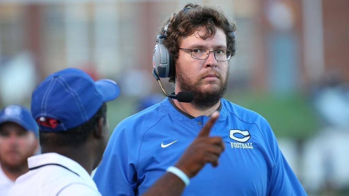 Clayton coach Hunter Jenks listens on the sidelines during the football game with the Clayton Comets high school and the Garner Trojans high school in Clayton N.C. on August 18, 2017. The Johnston County school system is apologizing to Jenks, who resigned in 2019.