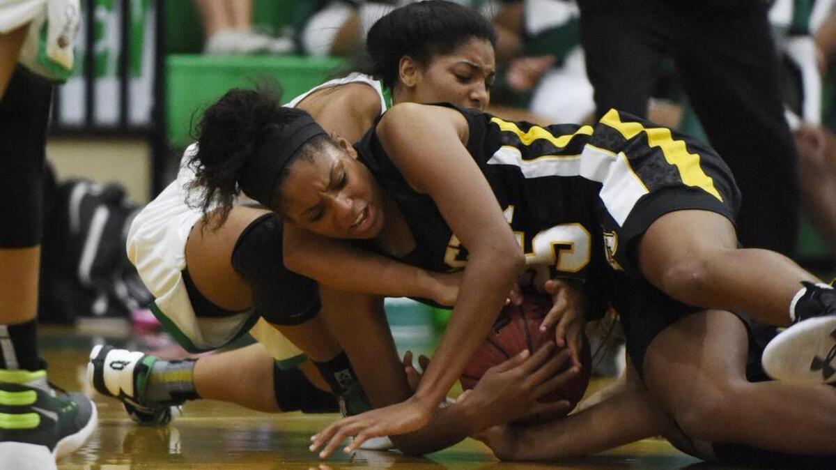 Photo Gallery: Photographer Liz Condo’s coverage from the Apex Cougars and Cary Imps boys and girls basketball games in Cary, N.C. on Friday, December 2, 2016.