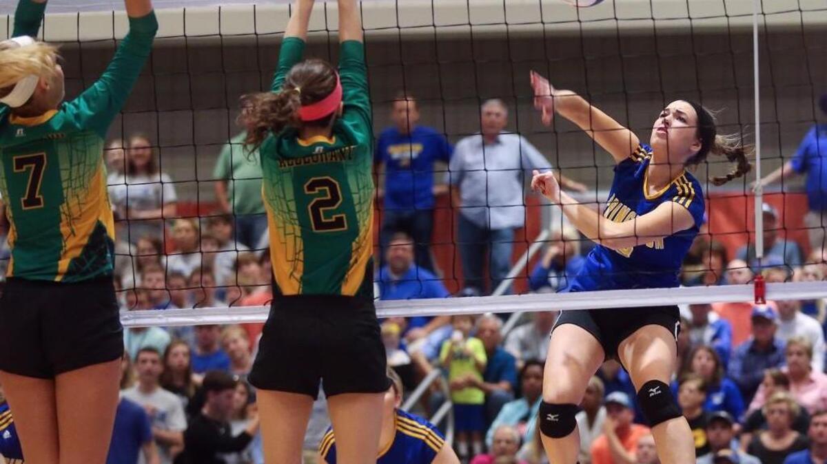 Princeton’s Daisy Eklund (9) sends a killshot by Alleghany defenders Kayla Lafferty (2) and Kasey Caudill (7). coverage of the 1A NCHSAA State Championship Volleyball Tournament Finals between the Princeton Bulldogs and the Alleghany Trojans played at the Raleigh Convention Center on Saturday, November 7, 2015. Alleghany won the title 3-1.