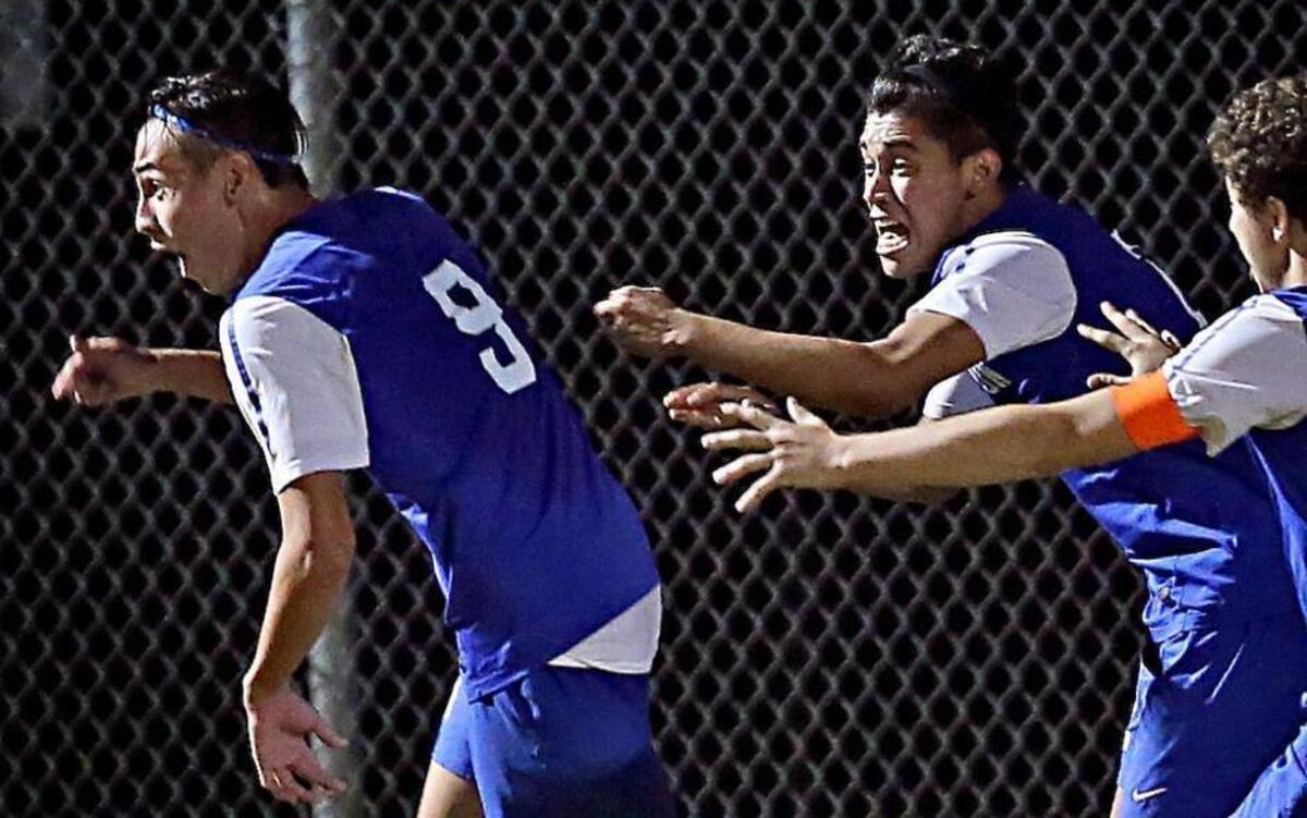 Clayton's Juan Alvarado (9) and Jorge Alonso (2) react to the game winning goal to win the JUSA Cup. Coverage from the JUSA Cup Championship Soccer game between the Corinth Holders Pirates and the Clayton High Comets played in Archer Lodge, N.C. on Thursday, October 22, 2015. Clayton won on overtime 4-3.