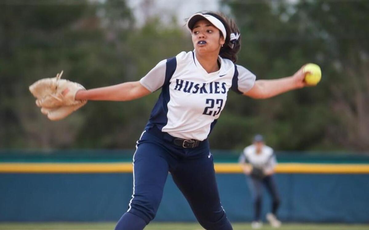 Heritage's Imani Rochelle (23) pitches during Rolesville's softball game at Heritage on Tuesday, March 7, 2017. Heritage won the game 5-1.