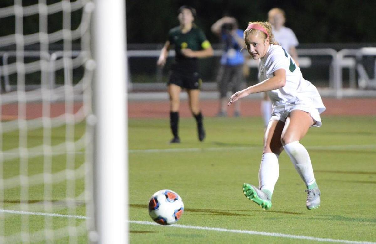 Maggie Pierce of Cardinal Gibbons scores the third goal for the Crusaders. The Cardinal Gibbons Crusaders played the West Forsyth Titans in a soccer game that took place in Raleigh, N.C. on Saturday, May 27 2017. West Forsyth won 4-3.