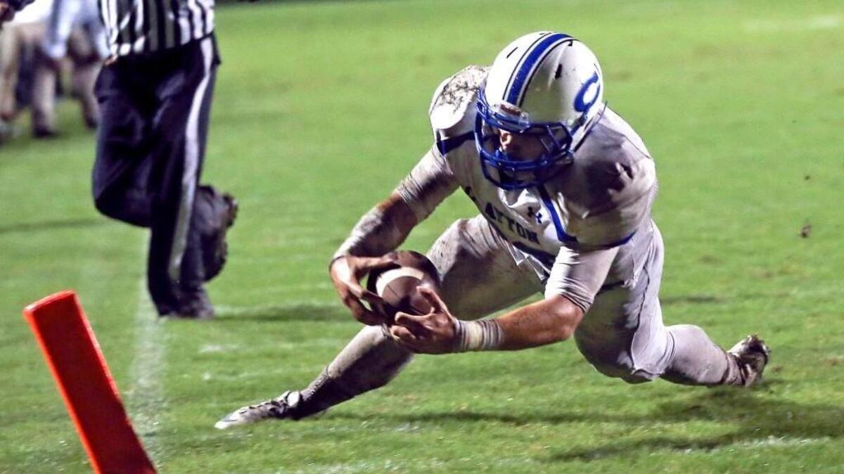 Clayton's Blake Joyner (32) dives for the flag to make the game winning touchdown after pulling in teammate Landen Leiser's pass. Coverage from the high school football game between the Clayton Comets and the Knightdale Knights played in Knightdale, N.C. on Thursday, October 01, 2015. Clayton won 32-26.