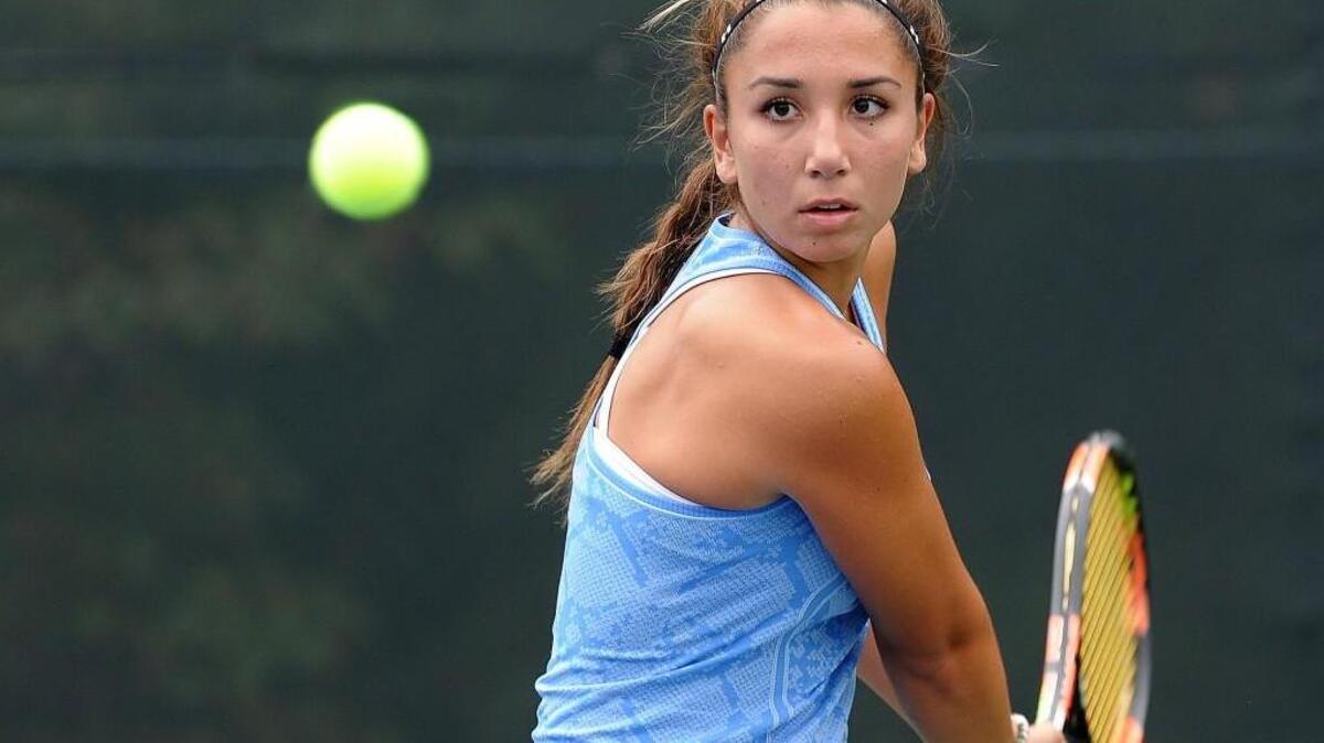 Panther Creek's Amanda Cyr sets to return the ball during the girls tennis match against Green Hope on Thursday, September 24, 2015 in Cary.