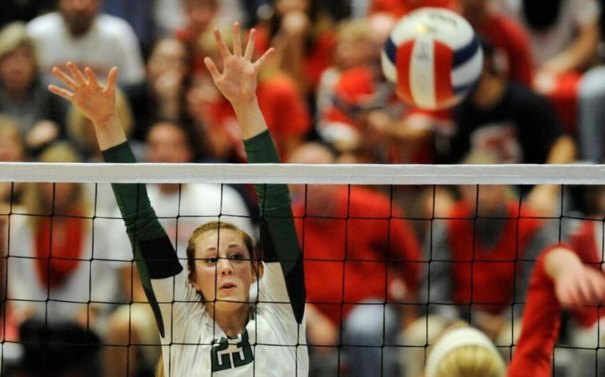 Cardinal Gibbons’ Briley Brind'Amour (23) tries to block a hit by Northwest Guilford's Morgan Stokley (10) in Raleigh, N.C. on Saturday, November 7, 2015. Cardinal Gibbons won 3-0 to become the Class AAAA State Champions.