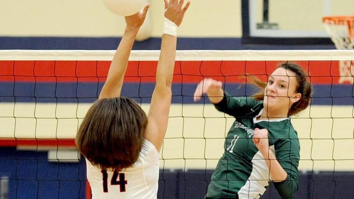 Green Hope’s Abby Kott (11) spikes the ball past Jordan's Justine Jones (14) during the volleyball game in the first round of the NCHSAA playoffs on Saturday, October 24, 2015 in Durham. Green Hope won 3-0.