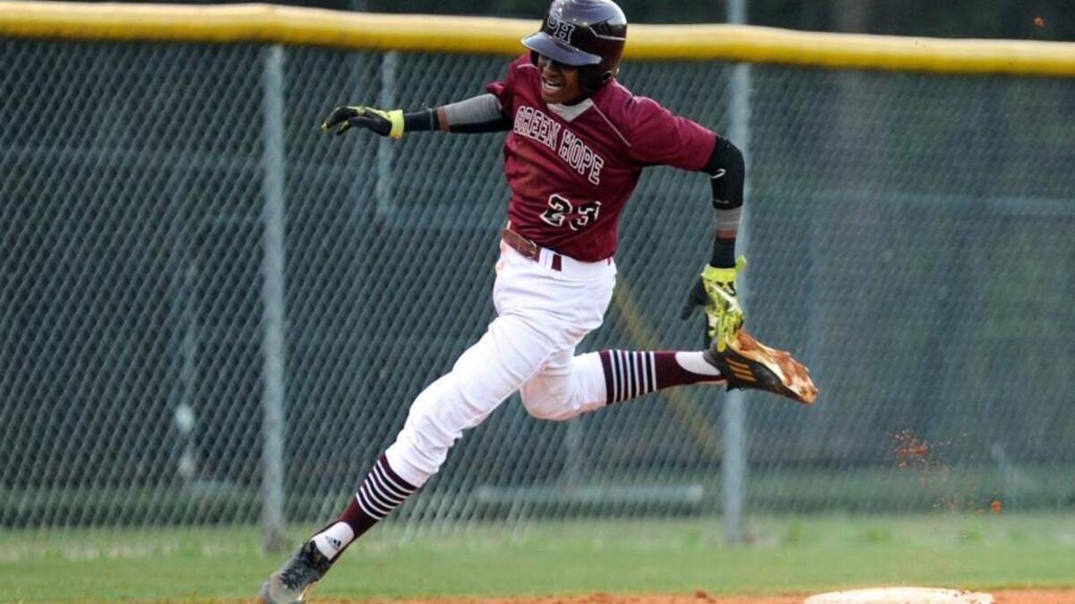 Green Hope's Joseph Nunn rounds third base on his way to scoring a run against Wakefield during the Bobby Murray Tournament, which took place in Raleigh on Saturday, April 2, 2016. Green Hope won 11-1.