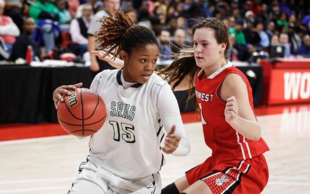 Southeast Raleigh's Jada McMillian (15) drives the baseline during the NCHSAA 4A Girls Basketball State Championship game between Southeast Raleigh and Northwest Guilford in Raleigh on Saturday, March 11, 2017. Northwest Guilford won the game 36-34.