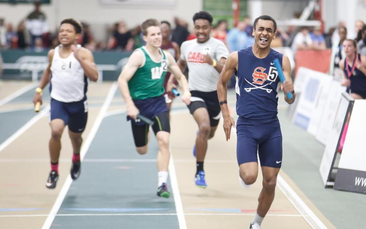 Southern Lee's Benjamine Buie strains as he reaches the finish line to win the 2x200 meter relay during the NCHSAA 3A indoor track state championship in Greensboro on Saturday, February 11, 2017.