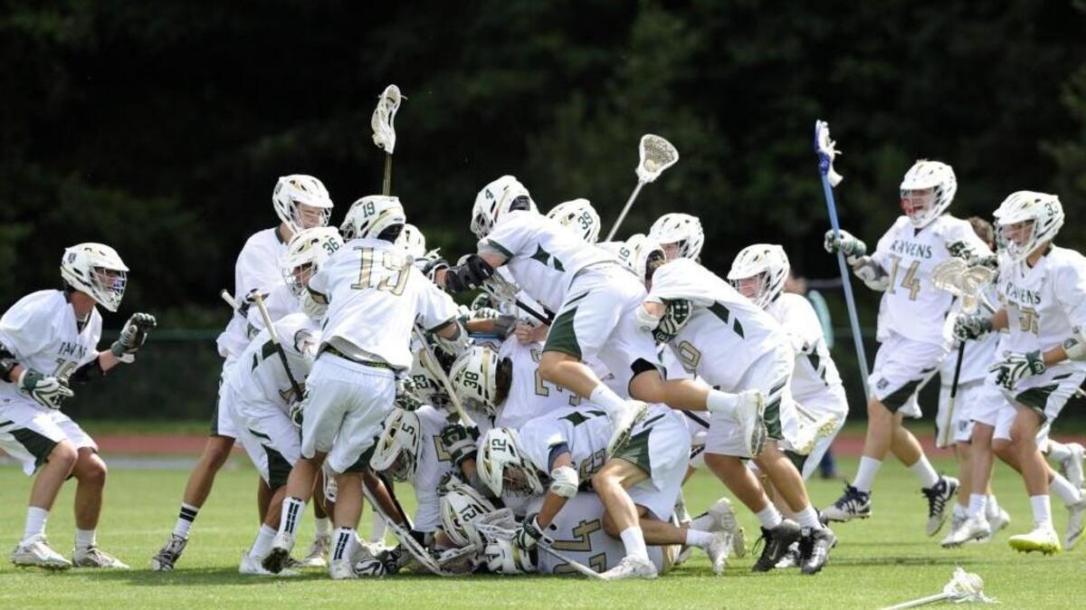 Ravenscroft celebrates their win over Christ School in the NCISAA State Championship in Raleigh, N.C. on Saturday, May 21, 2016. Ravenscroft won 9-7 to become the state champions.