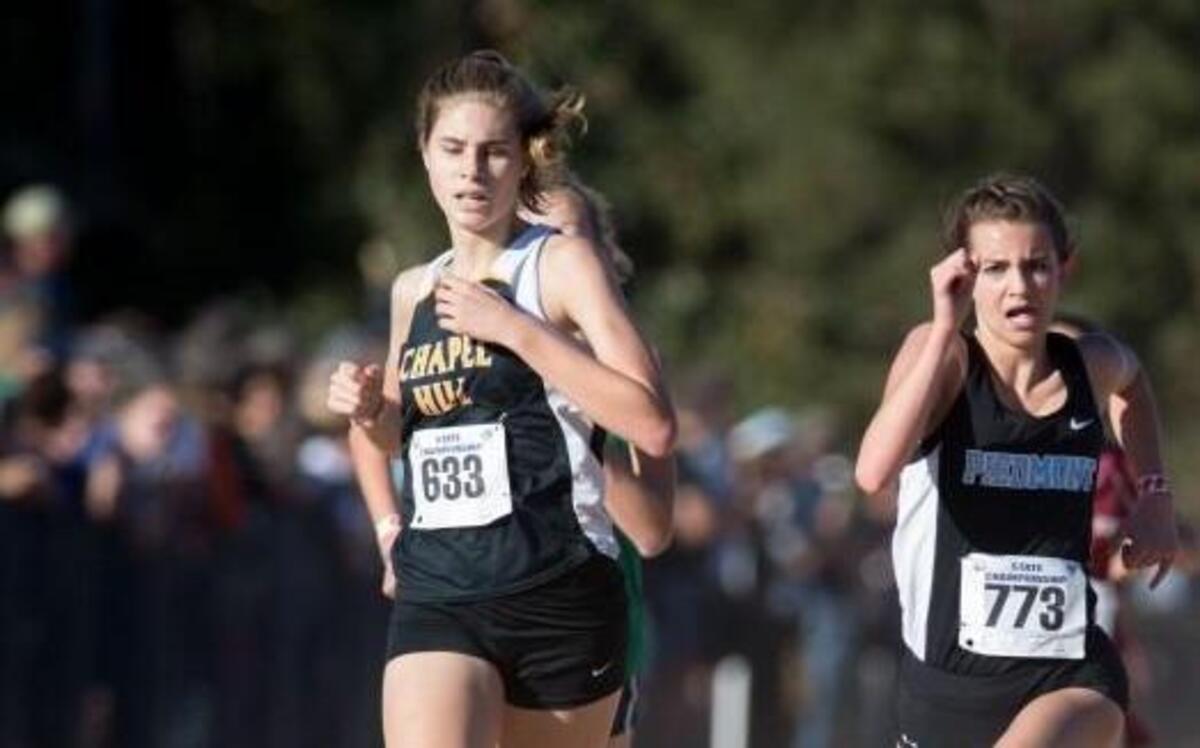 Chapel Hill's Madi Marvin loses ground to finish ninth behind Piedmont's Jaeden Phelix during the NCHSAA Class 3A Girls State Cross Country Championships that took place at Ivey Redmon Sports Complex on November 5, 2016 in Kernersville, North Carolina.