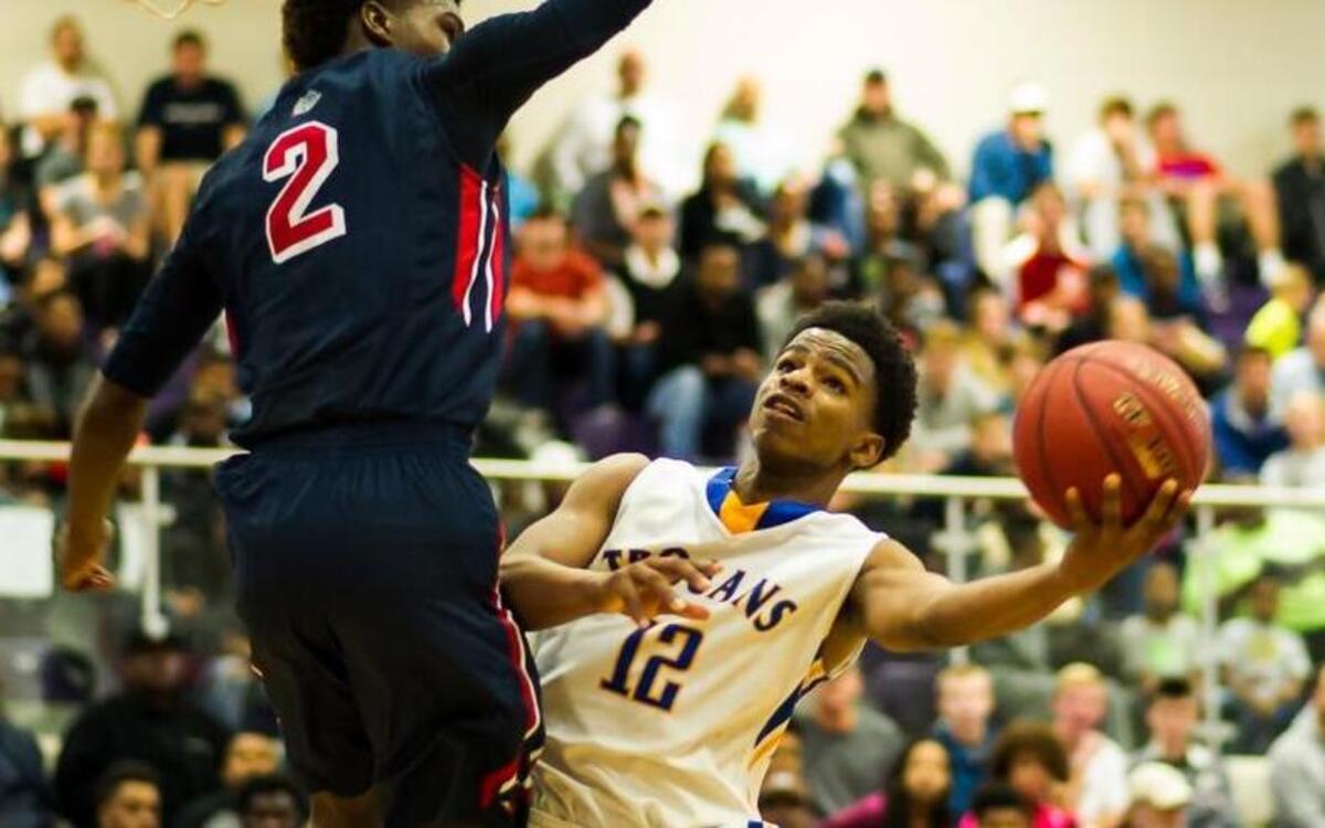 Garner’s Thomas Allen (12) shoots over Terry Sanford's Malik Johnson (2) during a basketball game at the HighSchoolOT.com Holiday basketball tournament at Broughton High School in Raleigh on Monday, December 28, 2015. The Terry Sanford Bulldogs won 83-79.