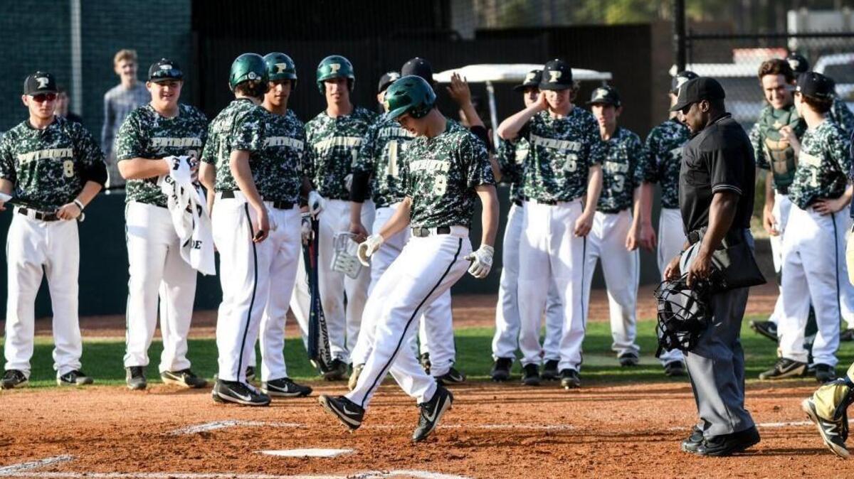Pinecrest's Nik Pry (9) touches home plate to complete a home run during Lee County's baseball game at Pinecrest on Wednesday, March 29, 2017, in Southern Pines, N.C. Pinecrest won by a score of 13-6.
