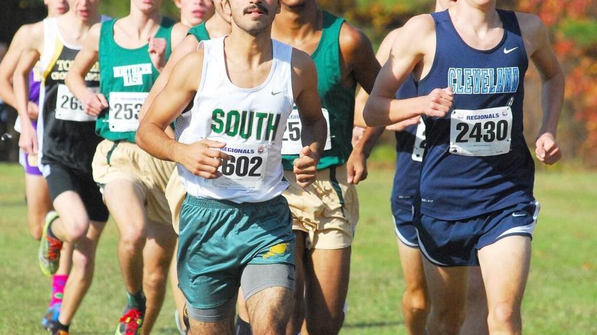 South Johnston’s Jacob Gonzalez and Cleveland’s Gable Dershem run in the NCHSAA 3A East Regional Cross County Championships at Red Oak Middle School in Nashville on Saturday.
