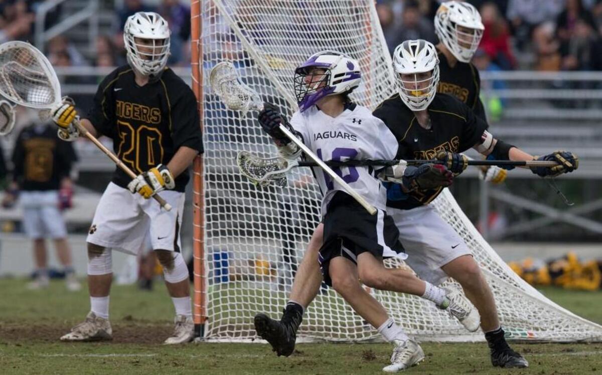 Carrboro’s Logan Marro, center, manuevers for a shot against Chapel Hill in Wednesday night’s NCHSAA lacrosse 3/2/1A East Region final. Carrboro won the game 4-2 and advances to Friday’s NCHSAA championship game in Cary’s WakeMed Park against Waxhaw Marvin Ridge.