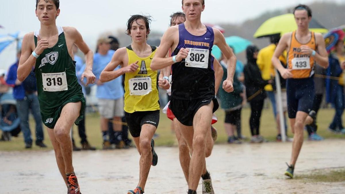 Jeremy Brown (302) of Broughton, Ben Savino (290) of Apex and Connor Lane (318) of Cardinal Gibbons run during the 4A NCHSAA Cross Country Championships that took place at the Ivey M. Redmon Sports Complex in Kernersville, N.C. on Saturday, November 7, 2015.