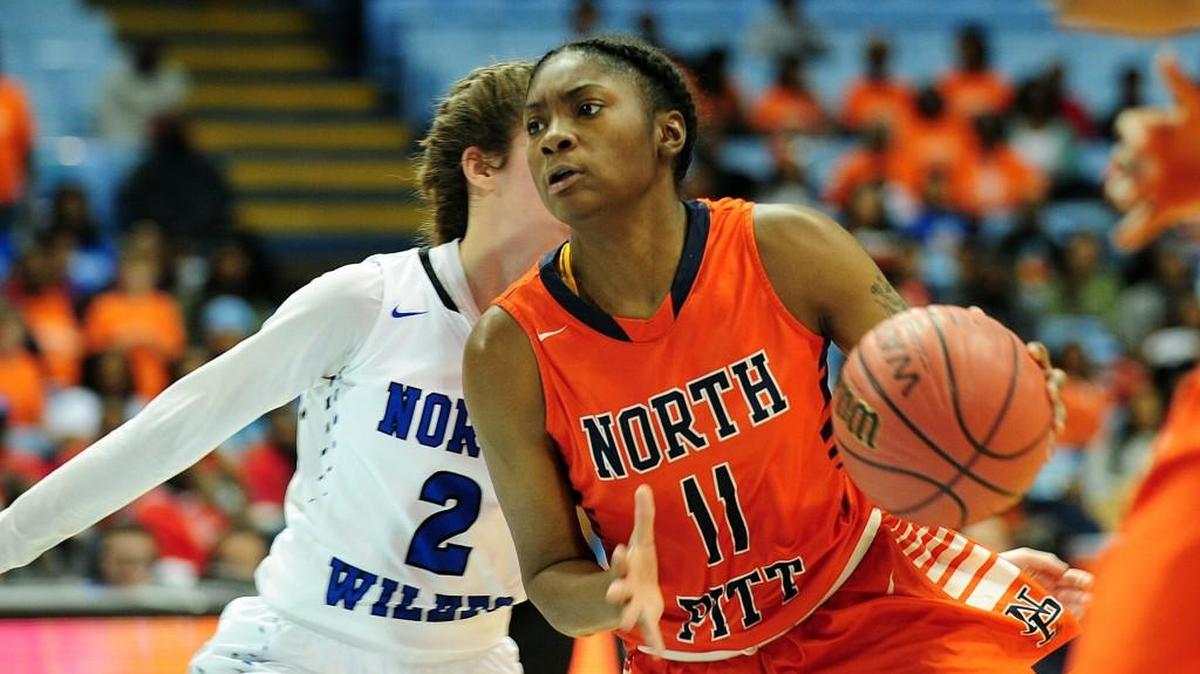 North Pitt's Nyjanique Langley (11) drives to the basket past North Wilkes' Victoria Young (2). The North Pitt Panthers and the North Wilkes Vikings played for the NCHSAA 2A girls basketball championship in Chapel Hill on Saturday, March 10, 2018.