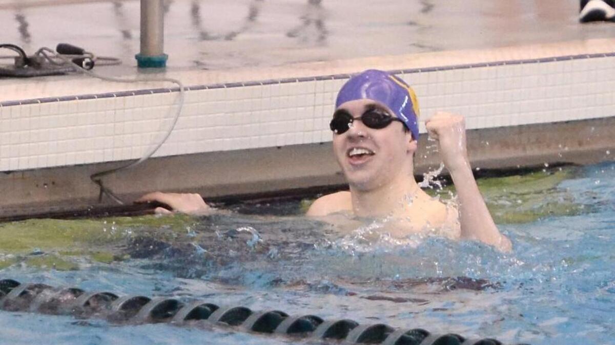 Connor Blandford of Corinth Holders celebrates at the end of the 200-yard individual medley race during the NCHSAA 3A State Swimming Championships at the Triangle Aquatic Center in Cary on Friday.