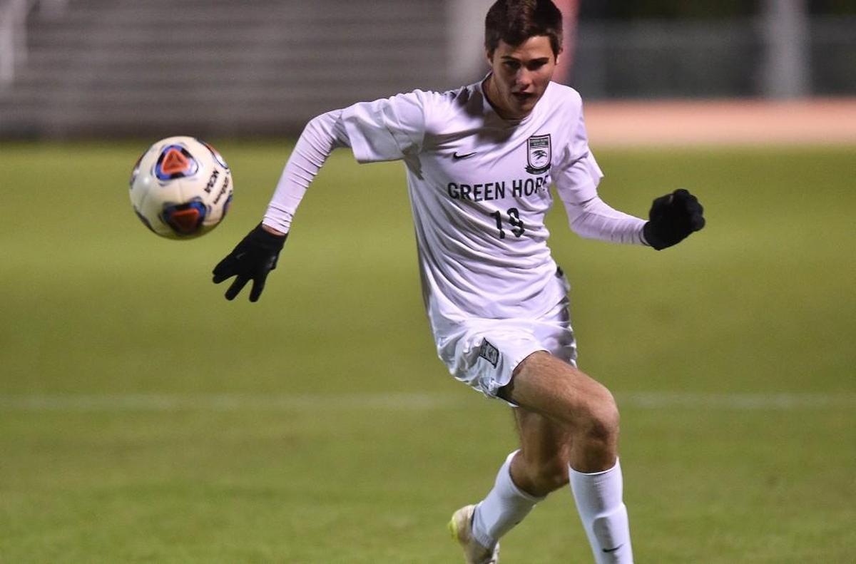 Green Hope's Camden Holbrook (19) runs down the ball in the NCHSAA 4A boys soccer finals with the Green Hope Falcons taking on the Porter Ridge Pirates at N.C. Stat University in Raleigh , N.C. on November 19, 2016. Green Hope won 3-0.