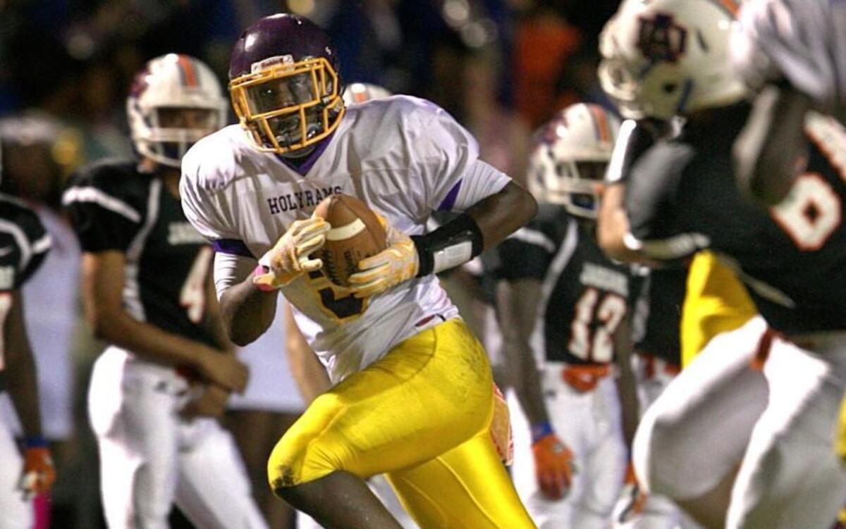 
Word of God's NyQuan Williams (5) intercepts a pass by Athens Drive quarterback Tre Echols (8) to set up the Ram's third touchdown in the first quarter at Athens Drive High School on Friday, October 9, 2015 in Raleigh, N.C.
