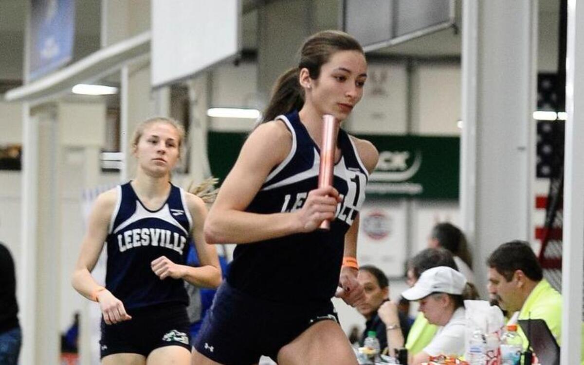 Leesville Road's Nevada Mareno runs the final leg of their Championship run of the girl's 4x800 meter relay, during The NCHSAA 4A Indoor Track and Field Championship, Saturday February 14, 2015 in Winston Salem, N.C.