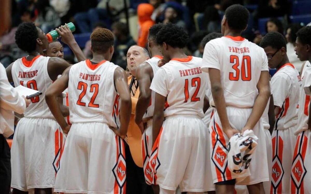 North Pitt coach Mark Carson talks with the team during one of the timeouts taking during the J.H. Rose High School boy's basketball game against North Pitt High School in Bethel, N.C. on Monday, November 28, 2016.