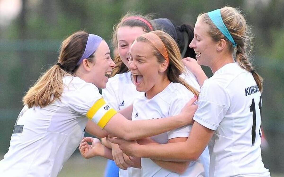 Knightdale’s Brenna Hardy (8) is congratulated by teammates after scoring in the second half putting Knightdale up 7-0.The Knightdale Knights took on the East Wake Warriors in soccer in Knightdale, N.C. on April 6, 2016. Knightdale wins 9-0.