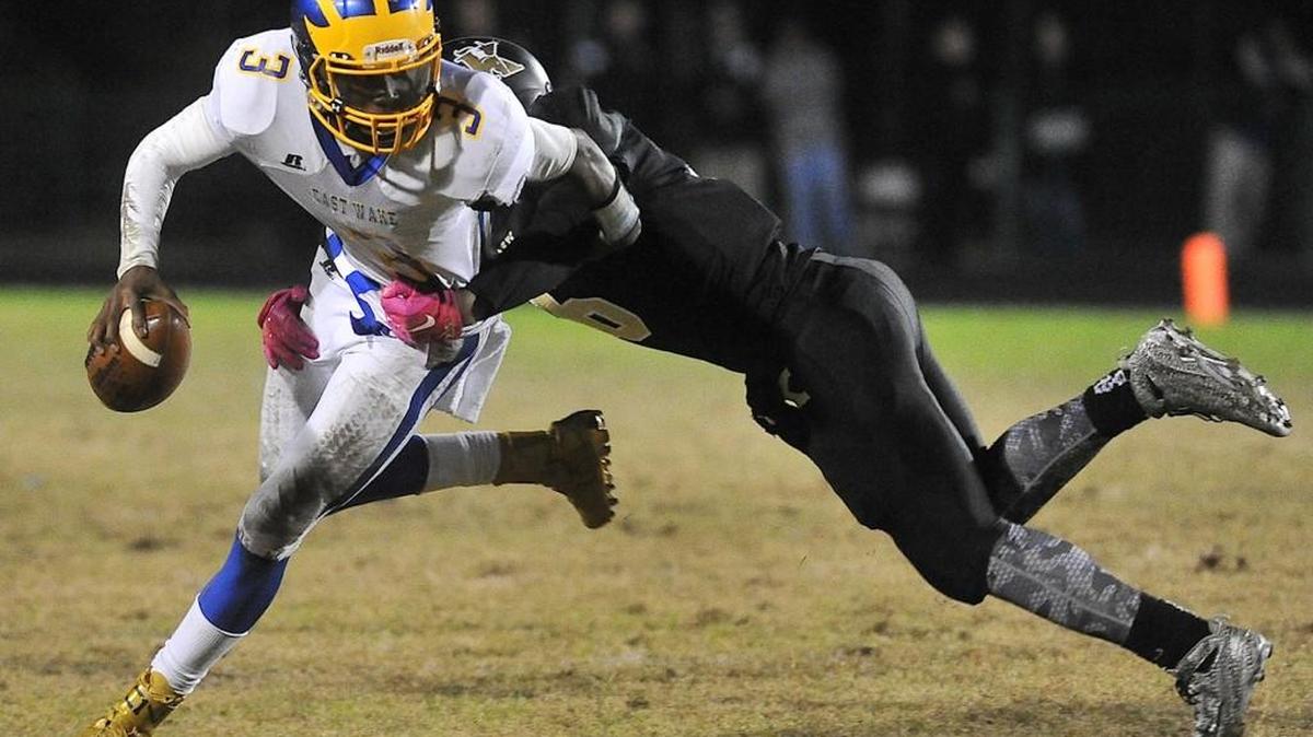 Tripp Harrington was the GNRC player of the year. Knightdale's Joshua Schenck (6) grapples East Wake 's Tripp Harrington (3) during the third quarter. The Knightdale Knights took on the East Wake Warriors in a football game in Knightdale, N.C. on Friday October 30, 2015. East Wake wins 21-20.