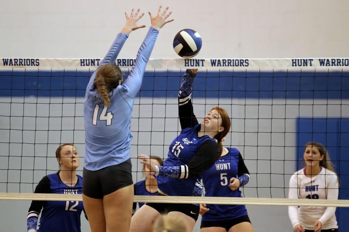 Hunt’s Michela Evans (15) spikes the ball past Union Pines’ Abby Vacha (14) during the Union Pines High School volleyball game against Hunt High School in Wilson, N.C. on Thursday, October 27, 2016.
