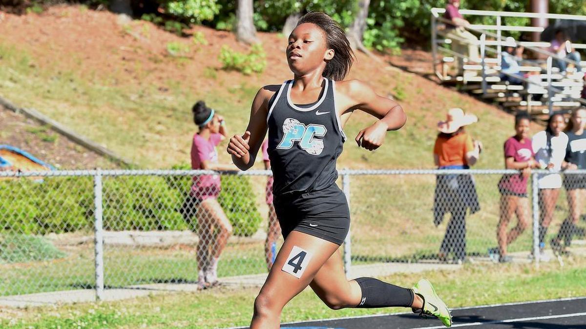 Panther Creek's Anyiah McCrimmon strides across the finish line to win her heat of the Girls 200 meter dash. The SWAC held its Track & Field Championships at Athens Drive High School in Raleigh, N.C. on May 3 2017. Panther Creek won the Girls Championship while Cary won the Boys.