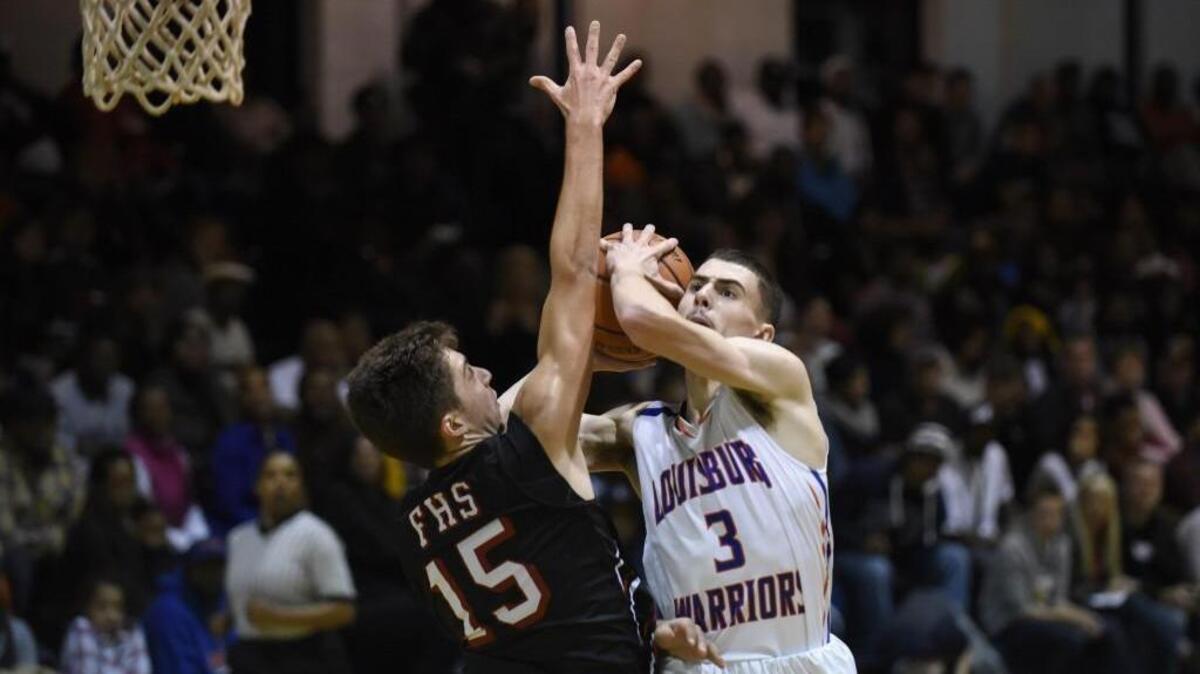 Louisburg's Andreas Wilson (3) shoots over Franklinton's Smith Gupton (15) in Louisburg, N.C. on Friday, December 9, 2016. Franklinton won 80-61.