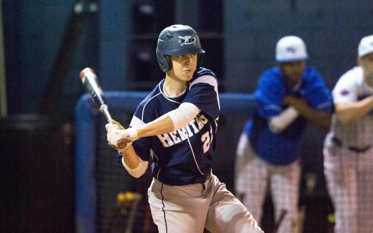 Heritage's Vito Patierno swings at a pitch during a high school baseball game against Wake Forest in Wake Forest, N.C. on Tuesday, Mar. 22, 2016.