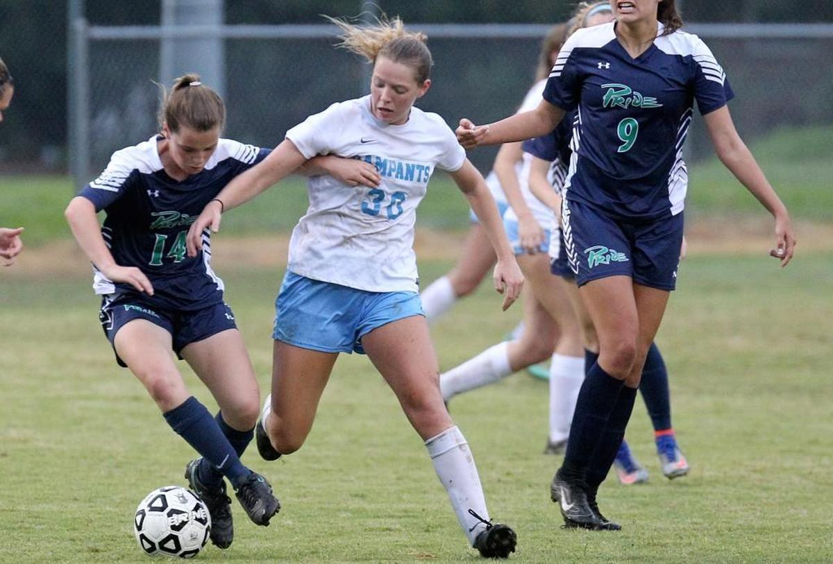 J.H. Rose’s Shelby Jones (30) battles for the ball during the Leesville Road High School girl's soccer game against J.H. Rose High School in Greenville, N.C. on Friday, May 12, 2017.