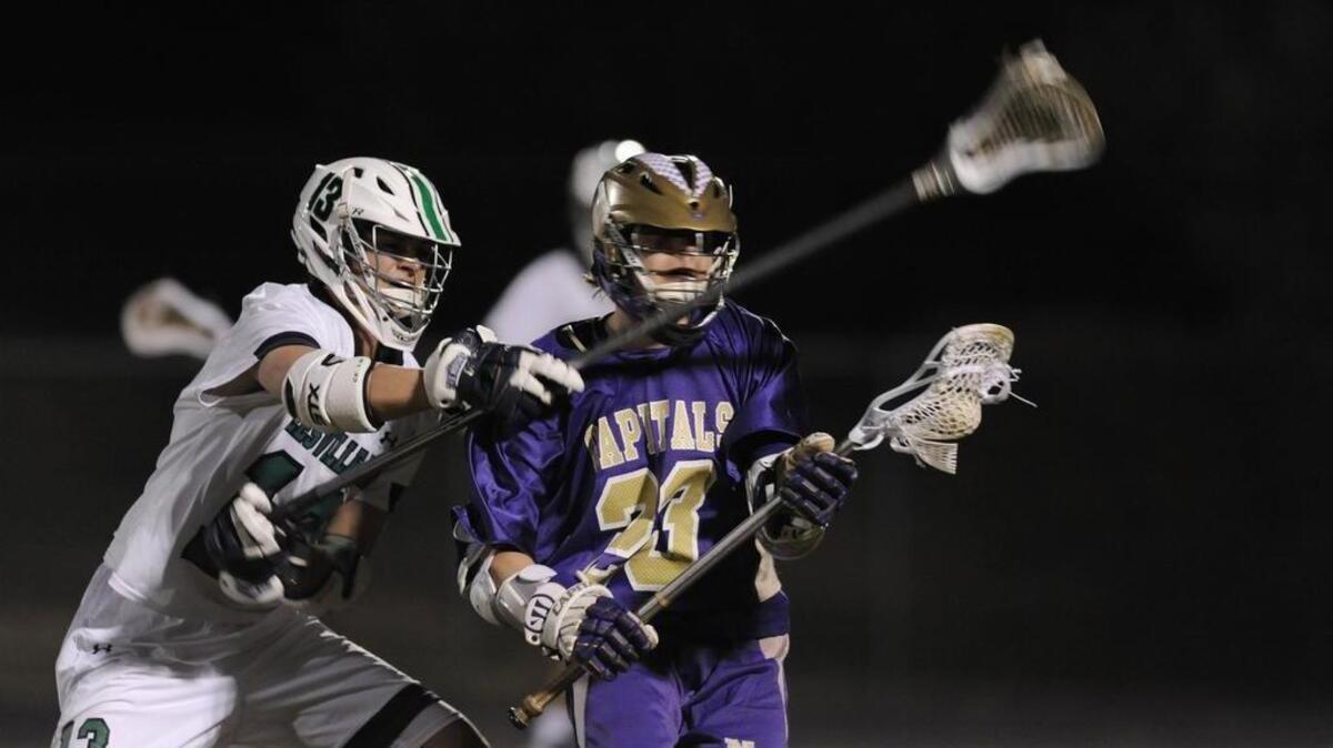 Leesville Road's Nate Yando (13) guards Broughton's Mitchel Snyder (23) in Raleigh, N.C. on Tuesday, March 1, 2016. Broughton won 12-8.