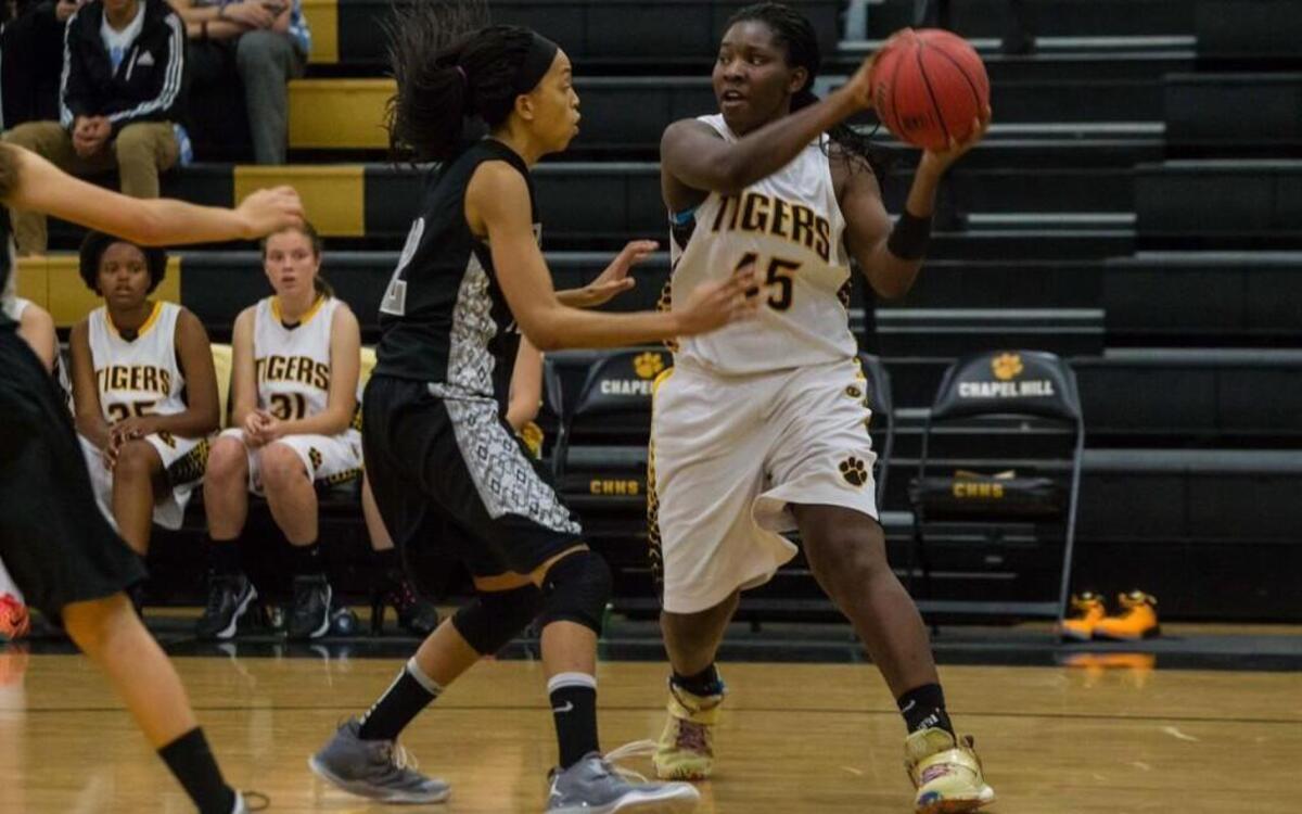 Chapel Hill sophomore Alliyah Chaplin (45) looks to pass during the Tigers’ 64-55 win Nov. 20, 2015, against East Chapel Hill. Chaplin earned “performance of the Week” honors Thursday after another pair of double-doubles in games last week against Cardinal Gibbons and Southern Durham.