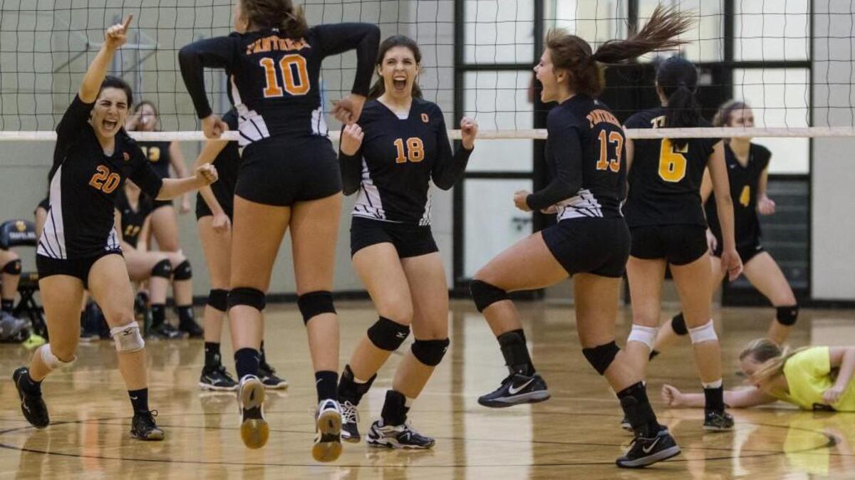 Orange’s Andie McKinnon (left, No. 2), Caroline Compton (10), Mileah Shriner (18) and Eva Porter (13) celebrate a 3-2 win against Chapel Hill on Sept. 17. McKinnon was named Big 8 player of the year.