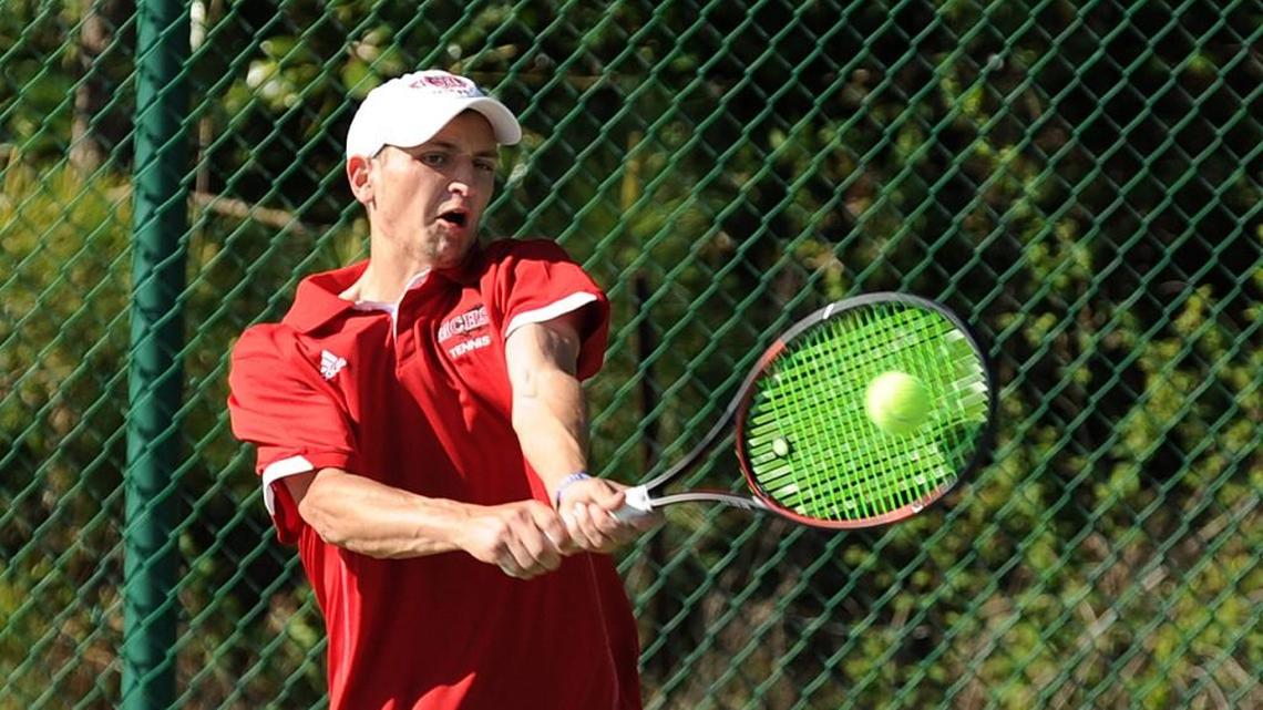 Middle Creek's Nick Stachowiak returns a serve during the boys tennis match against Panther Creek, which took place in Cary on Monday, April 4, 2016.
