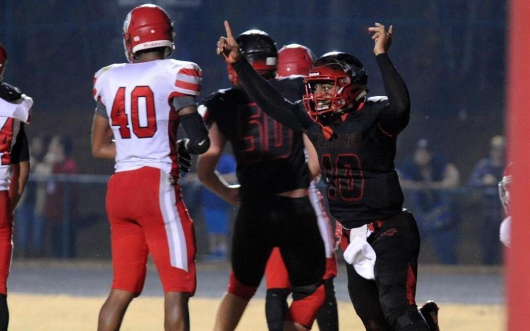 Middle Creek's Dominique Shoffner (10) celebrates his touchdown against Sanderson during the 4AA NCHSAA football second round playoff game, which was played in Apex on Friday, November 25, 2016.