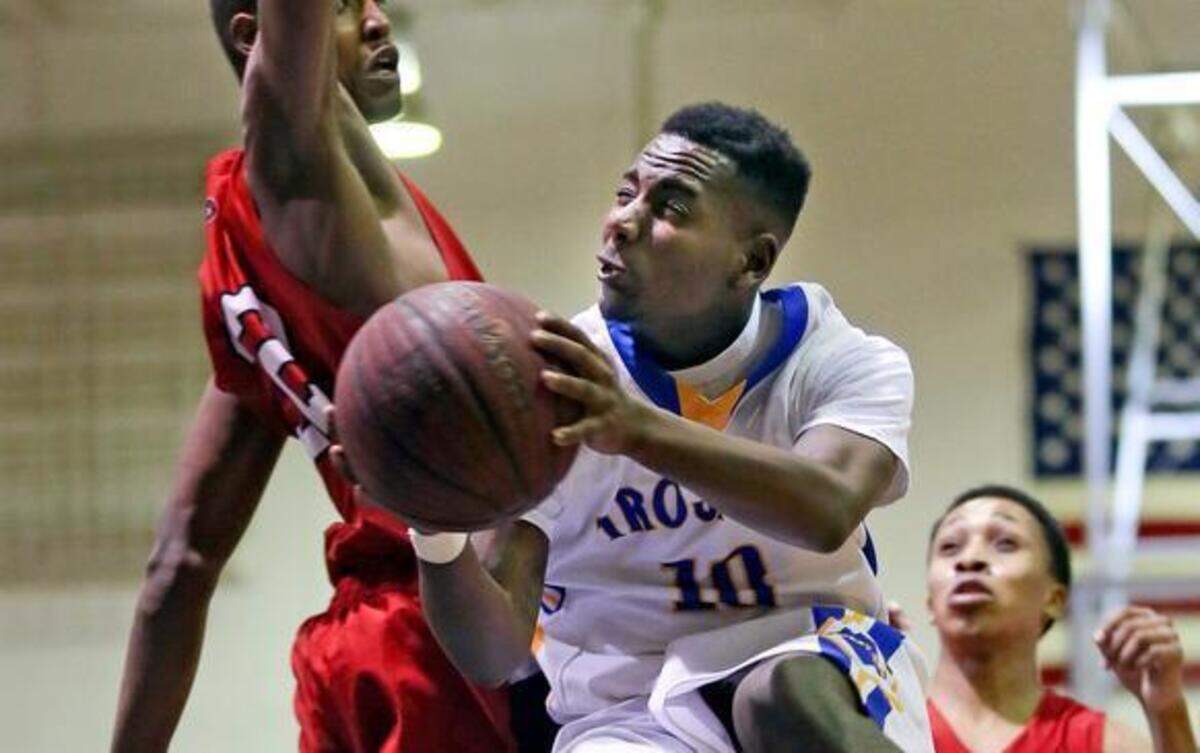 
Garner’s Julius Barnes (10), shown last month against Rolesville, and teammate Thomas Allen say the Trojans haven’t thought much about playing Millbrook on Saturday. Millbrook beat Garner in December, and the teams will face each other on Saturday in the NCHSAA 3A Eastern regional final. 
