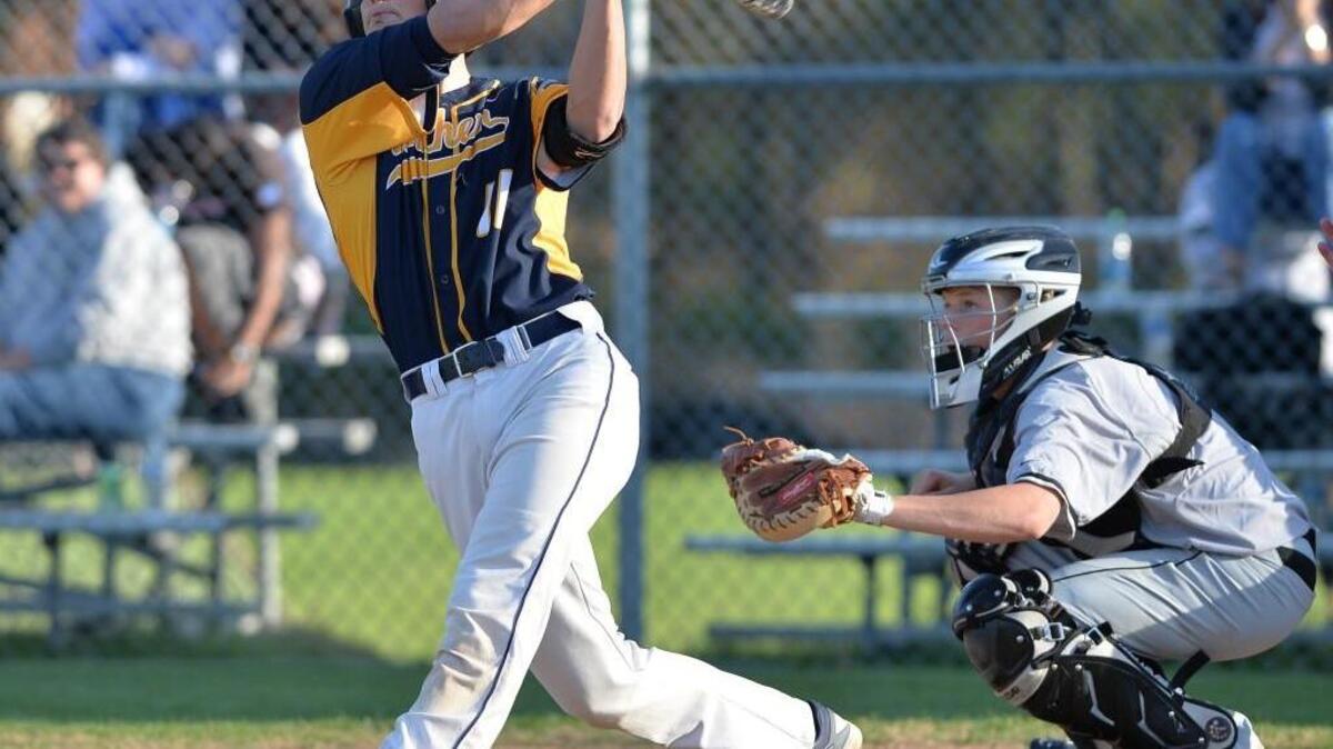 Spencer Smith (11) of Northern at bat against East Chapel Hill's catcher Bryce Jeske, right. The Northern Knights played the East Chapel Hill Wildcats in Durham, N.C. on Thursday, March 24, 2016. Northern won 11-6.