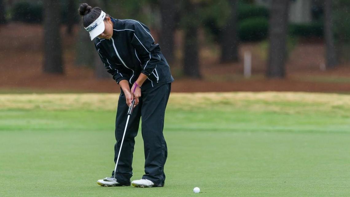 Jennifer Chang of Athens Drive sinks her final putt to post a two day total of 150 to win the 2015 NCHSAA 4A Women's Golf Championships at Pinehurst No. 6 in Pinehurst, NC on Tuesday, October 27, 2015.