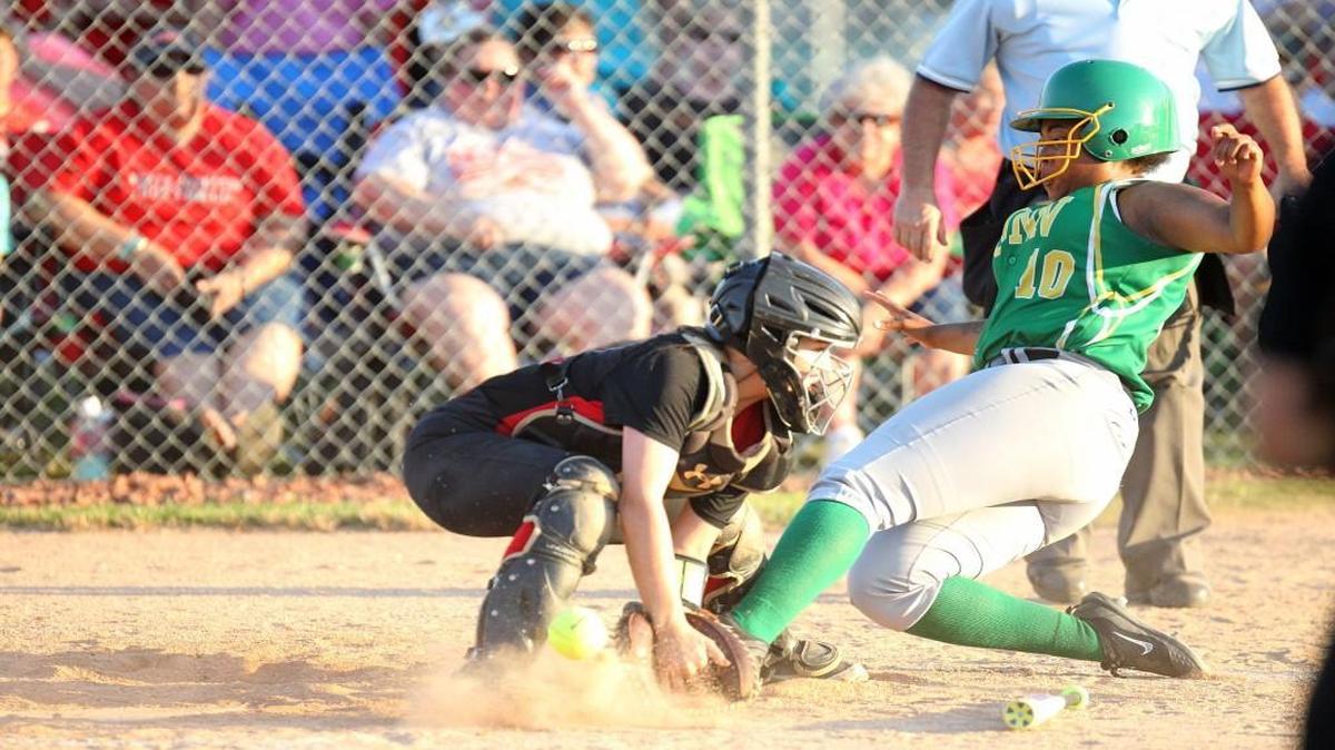 Bunn's Kamesha Rogers (10) slides safely at home during the Bunn High School softball game against North Johnston High School in Kenly, N.C. on Tuesday, May 16, 2017.