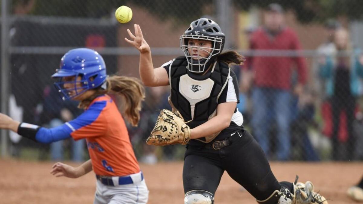 Louisburg's Mackenzie Wood (6) is forced out by Northside's Kendall Alligood (9) in Louisburg, N.C. on Thursday, May 19, 2016. Northside beat Louisburg 9-8.