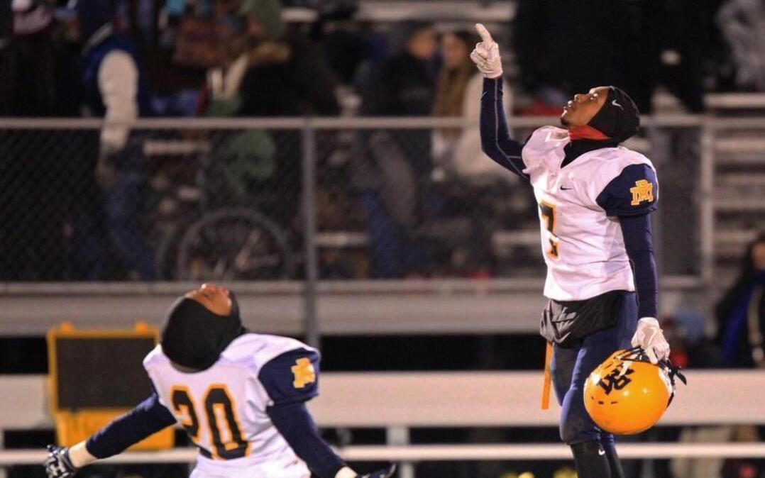 Donomesion Brown (20) and Isaac Edge (7) celebrate after Rocky Mount's win over Havelock at the Havelock High School vs Rocky Mount High School Round 4 NCHSAA 3A Football matchup on Dec 9, 2016.